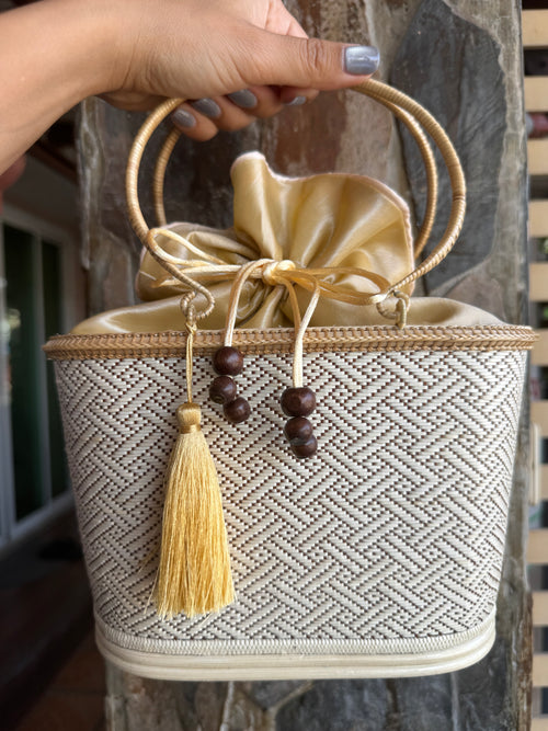 beige purse with tassel